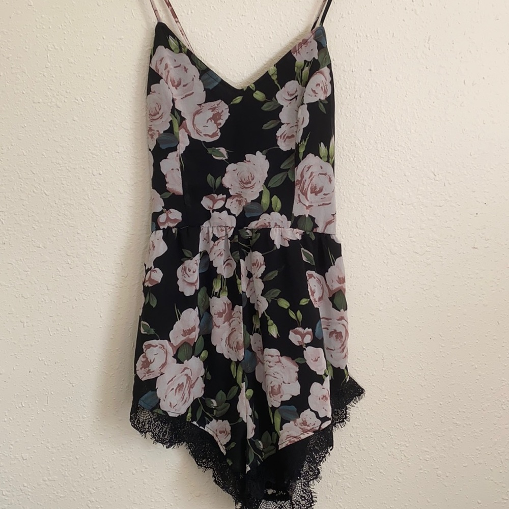 TOBI blacks and rose floral racer back romper. Size 4.